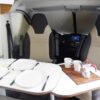 espace salon repas table Vans fourgon aménagé 3 places - EVAGO Location camping car